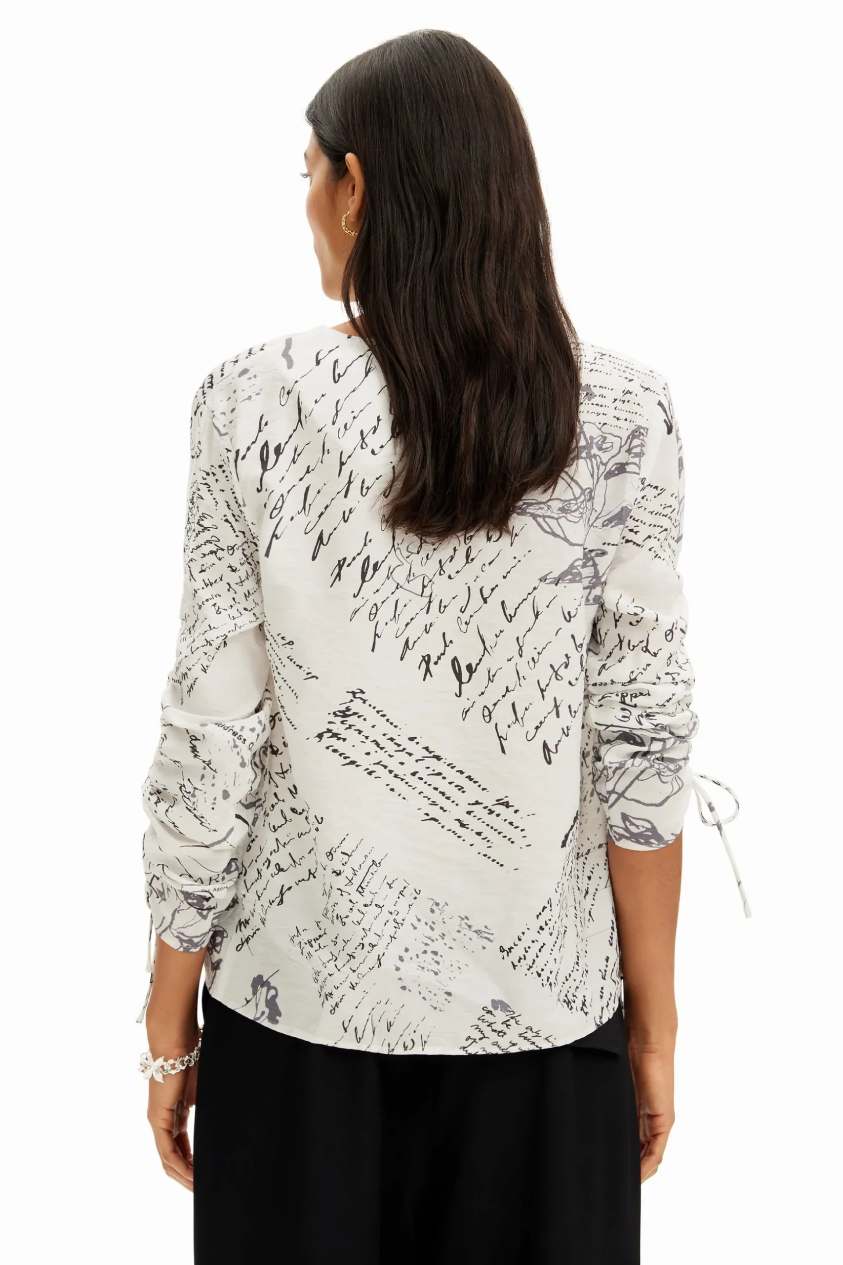 Blouse with adjustable sleeves and text prints.