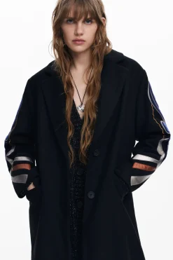 Coat with printed sleeves