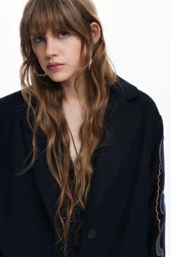 Coat with printed sleeves