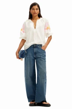 Flowy blouse with watercolor floral print.