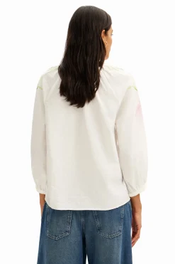 Flowy blouse with watercolor floral print.